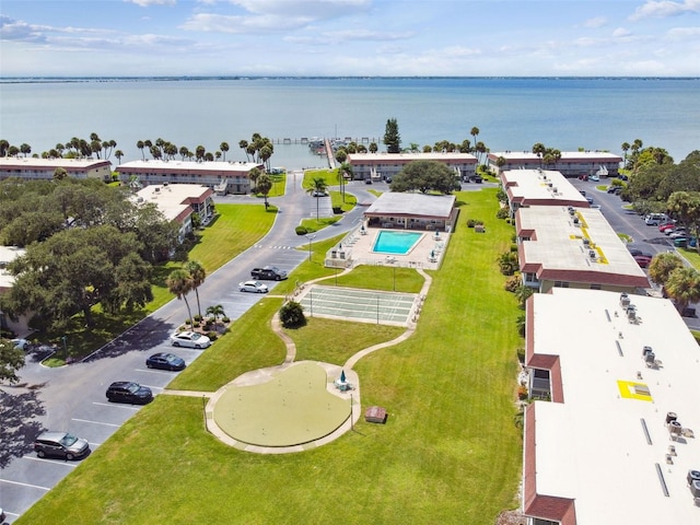 birds eye view of property with a water view