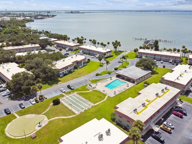 bird's eye view of a large body of water and a pool area