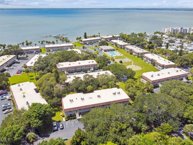 aerial view of a nearby body of water and apartment complex / building