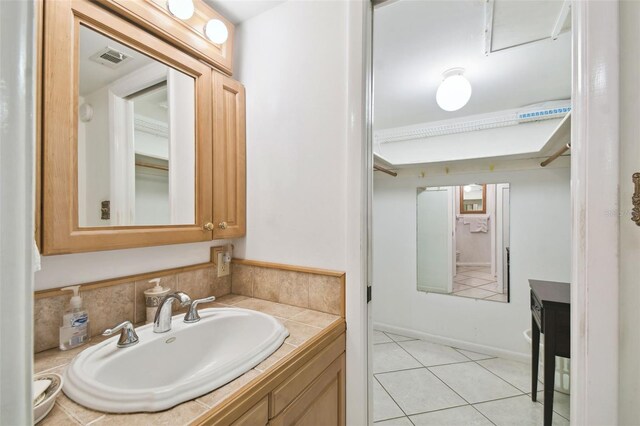 bathroom with vanity and tile patterned flooring