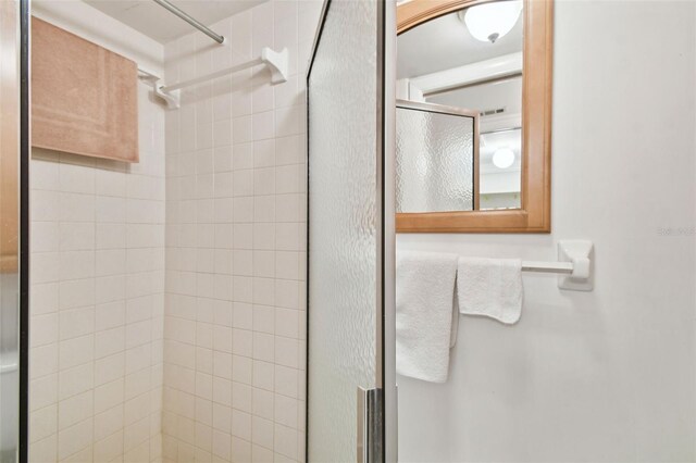 bathroom with a shower stall