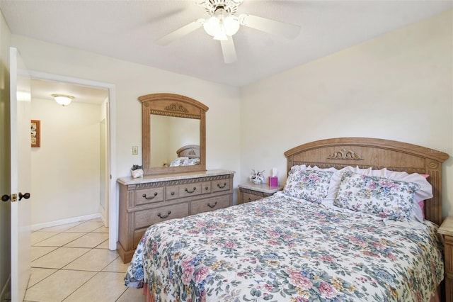 tiled bedroom with ceiling fan