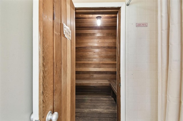 view of sauna with wooden walls