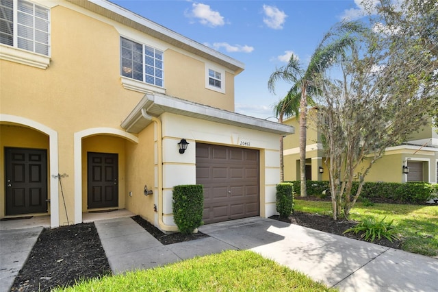 20461 Berrywood Ln, Tampa, FL 33647 - view of front facade featuring a garage, stucco siding, and concrete driveway