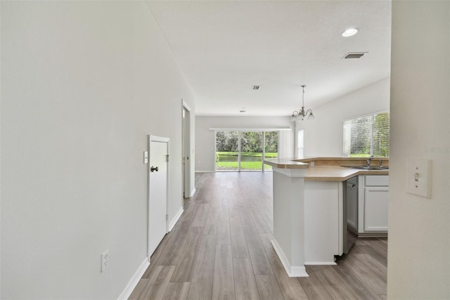20461 Berrywood Ln, Tampa, FL 33647 - hallway with recessed lighting, baseboards, a sink, and light wood-style flooring