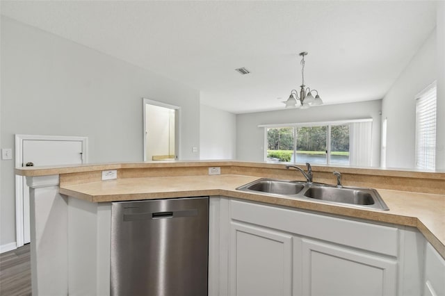 kitchen with a notable chandelier, dishwasher, white cabinets, and dark hardwood / wood-style floors