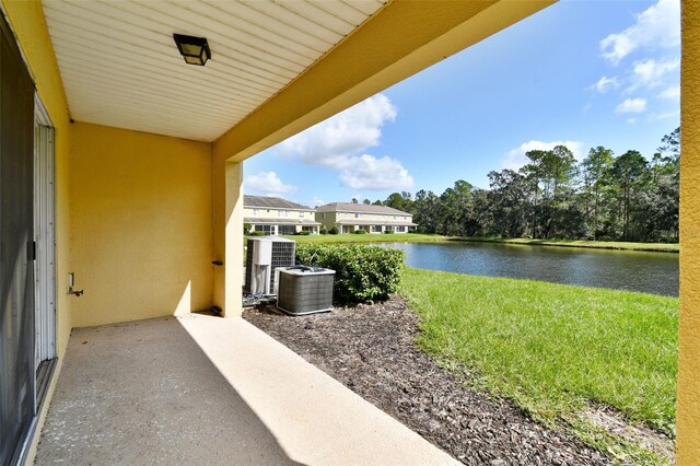 20461 Berrywood Ln, Tampa, FL 33647 - balcony featuring a water view and central AC unit