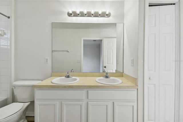 full bathroom featuring vanity, toilet, and tub / shower combination