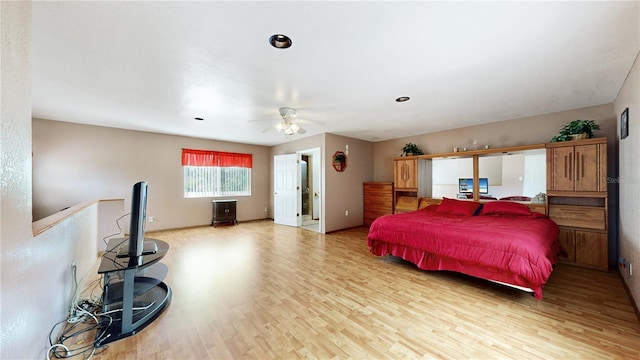 bedroom featuring ceiling fan and light hardwood / wood-style flooring