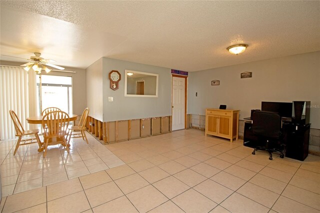 office space with ceiling fan, light tile patterned floors, and a textured ceiling