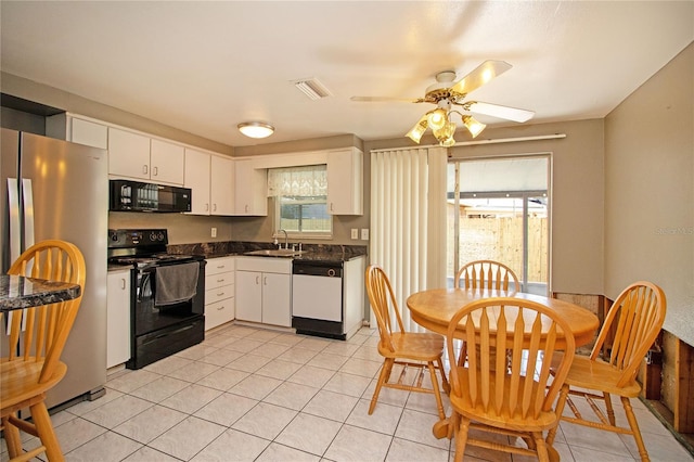 kitchen with ceiling fan, sink, light tile patterned floors, white cabinets, and black appliances