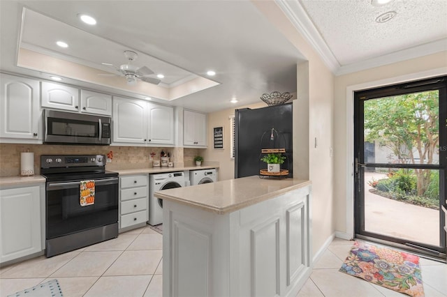 kitchen featuring washer / dryer, appliances with stainless steel finishes, ceiling fan, and white cabinets