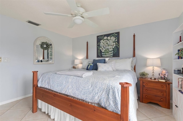 tiled bedroom featuring ceiling fan