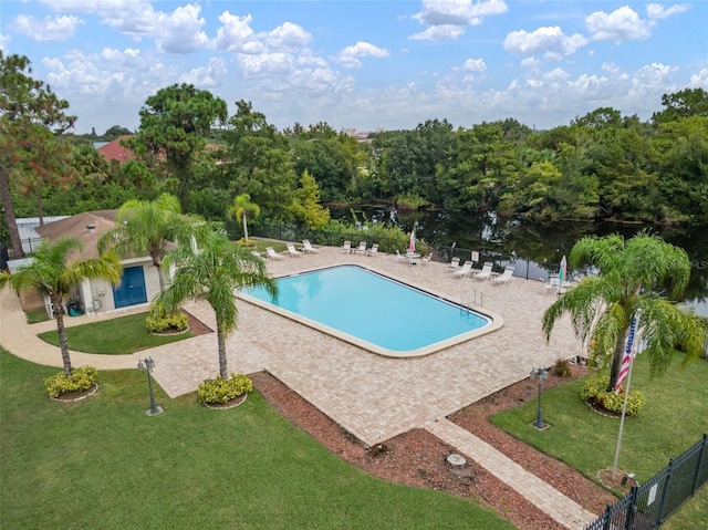 view of pool with a yard and a patio