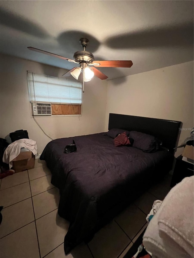 tiled bedroom with cooling unit and ceiling fan