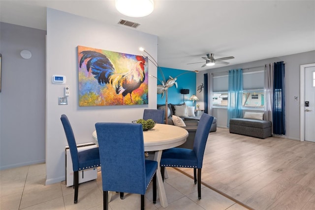 dining room featuring ceiling fan and hardwood / wood-style flooring