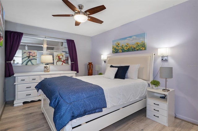 bedroom featuring light wood-type flooring and ceiling fan