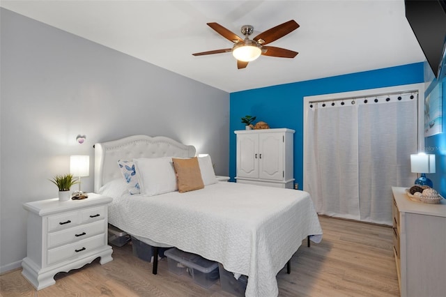 bedroom featuring light hardwood / wood-style flooring and ceiling fan