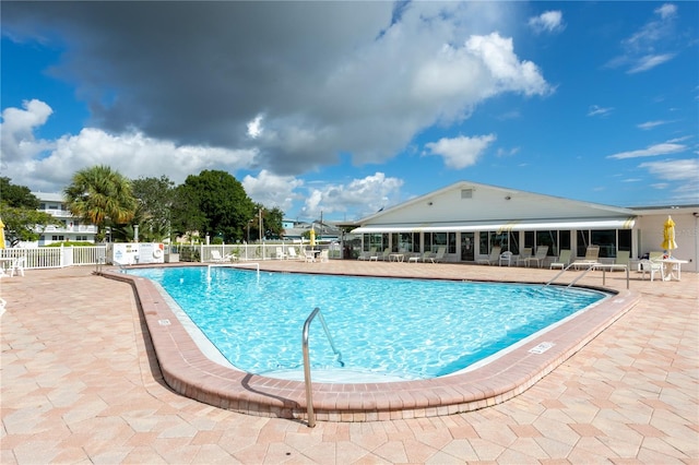 view of swimming pool with a patio