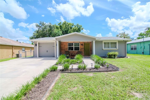 ranch-style house featuring a garage and a front yard