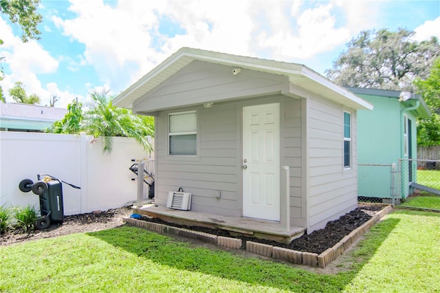 exterior space with a lawn and an outdoor structure