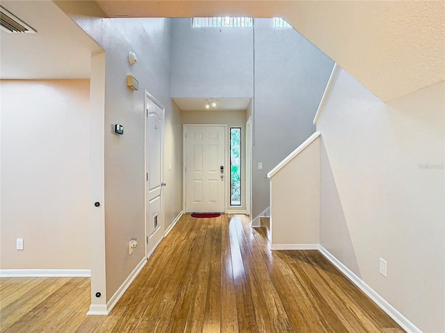 foyer with hardwood / wood-style floors