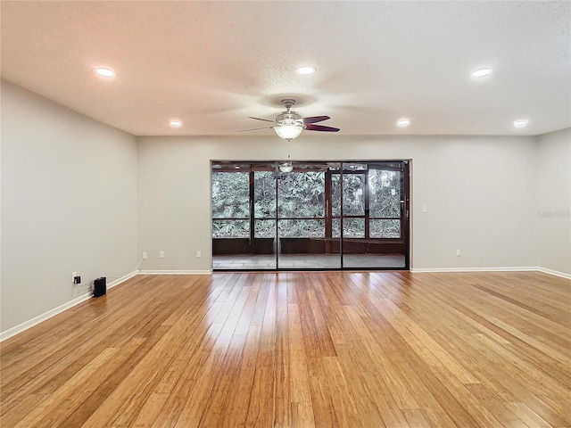 empty room featuring light hardwood / wood-style floors and ceiling fan