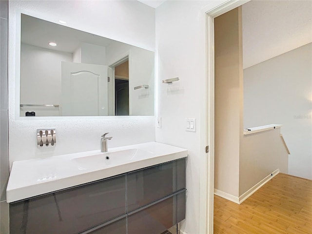 bathroom with vanity and wood-type flooring