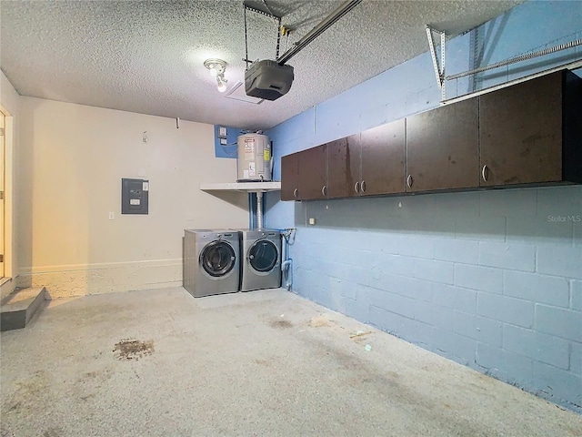 garage with a garage door opener, washer and dryer, electric water heater, and electric panel