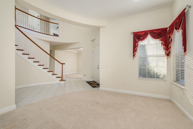 foyer featuring carpet floors