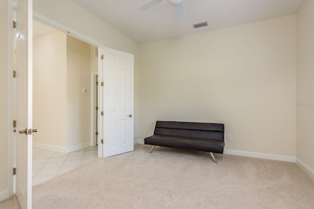 sitting room featuring ceiling fan and light colored carpet