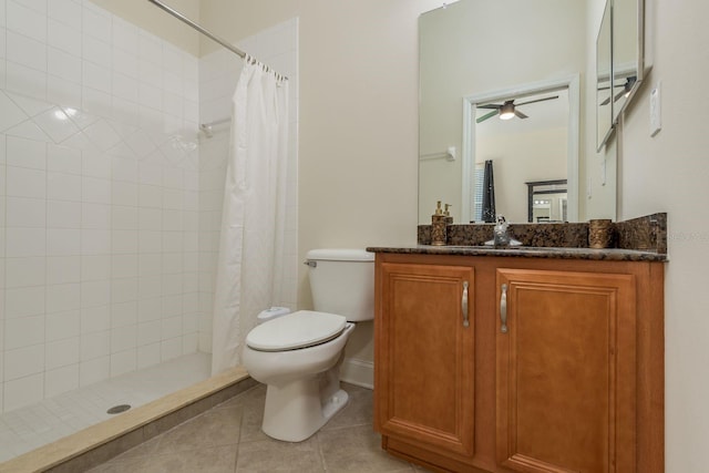 bathroom featuring curtained shower, vanity, toilet, and ceiling fan