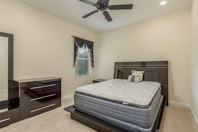 bedroom with light carpet and ceiling fan