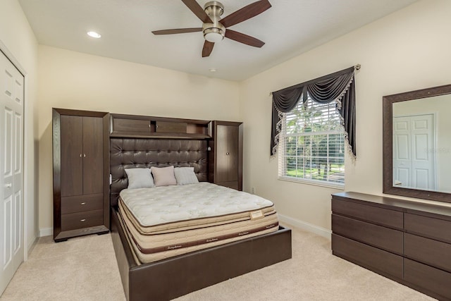 carpeted bedroom featuring ceiling fan