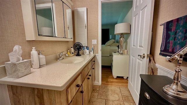 bathroom with vanity and wood-type flooring