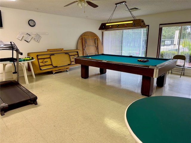 playroom featuring ceiling fan, a textured ceiling, and billiards