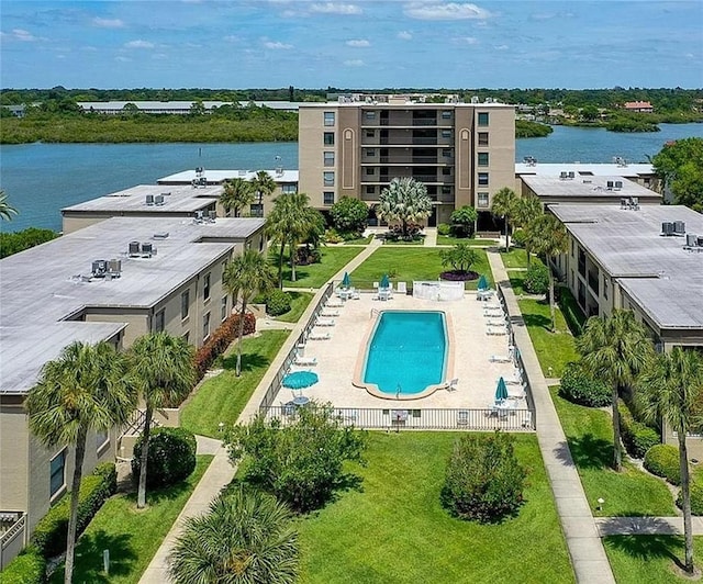 birds eye view of property with a water view