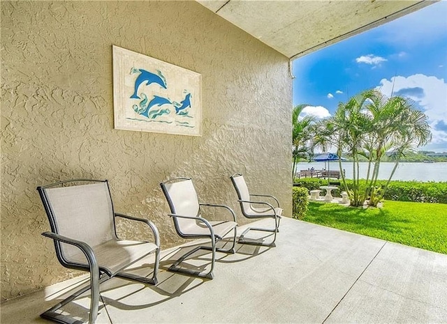 view of patio featuring a water view