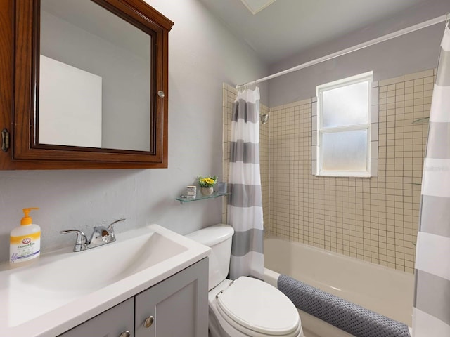 full bathroom with shower / bath combo, vanity, and toilet