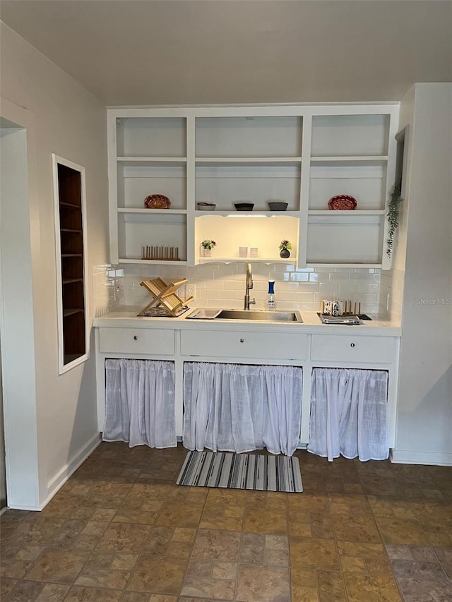 bar with decorative backsplash and sink