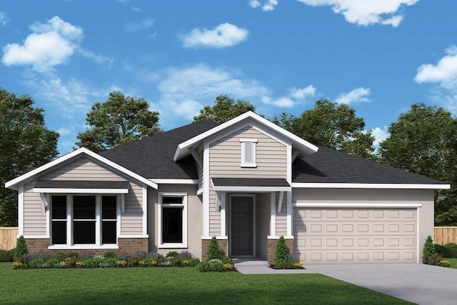 view of front of home featuring a front lawn and a garage