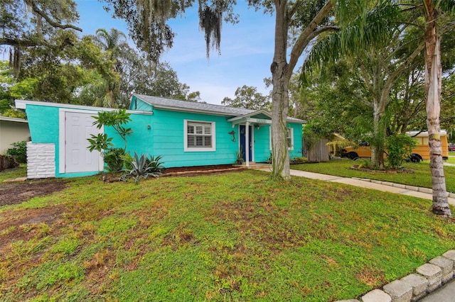 ranch-style house with a front yard