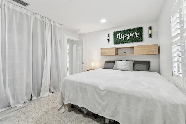 bedroom featuring wood-type flooring