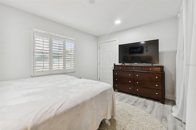 bedroom with light hardwood / wood-style flooring