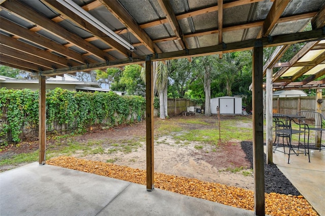 view of patio / terrace featuring a shed