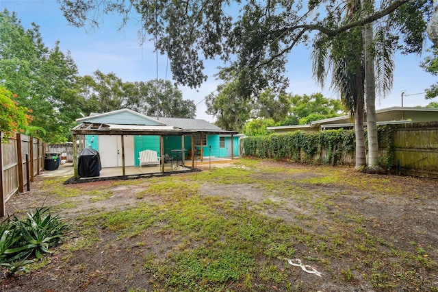 back of house with a patio area