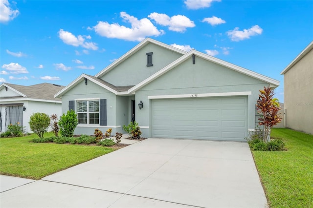 single story home featuring a garage and a front lawn