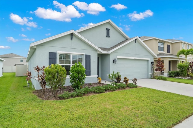 view of front of home with a garage and a front lawn