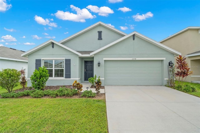 single story home with a garage and a front lawn