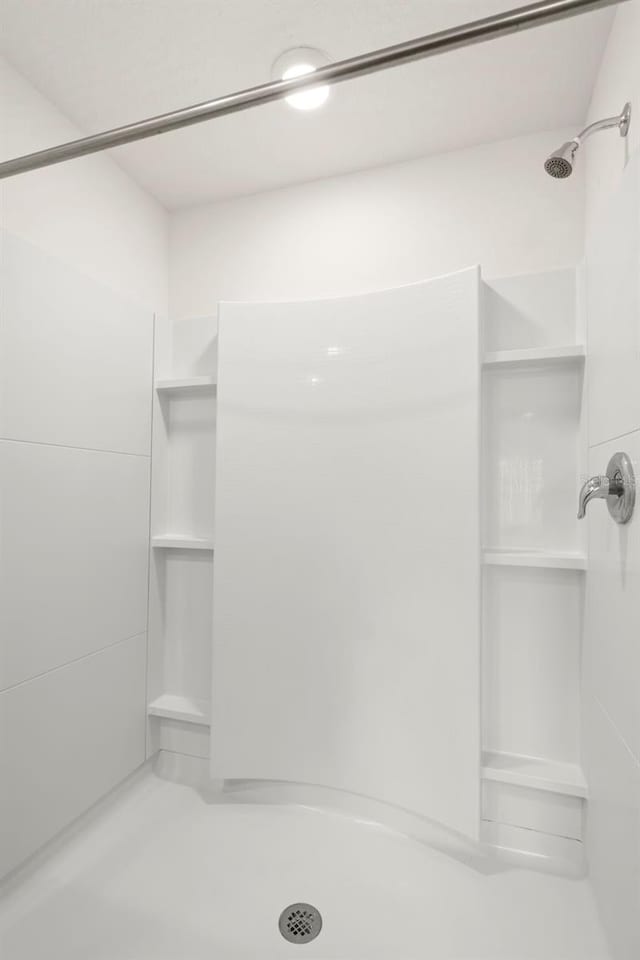 bathroom featuring walk in shower